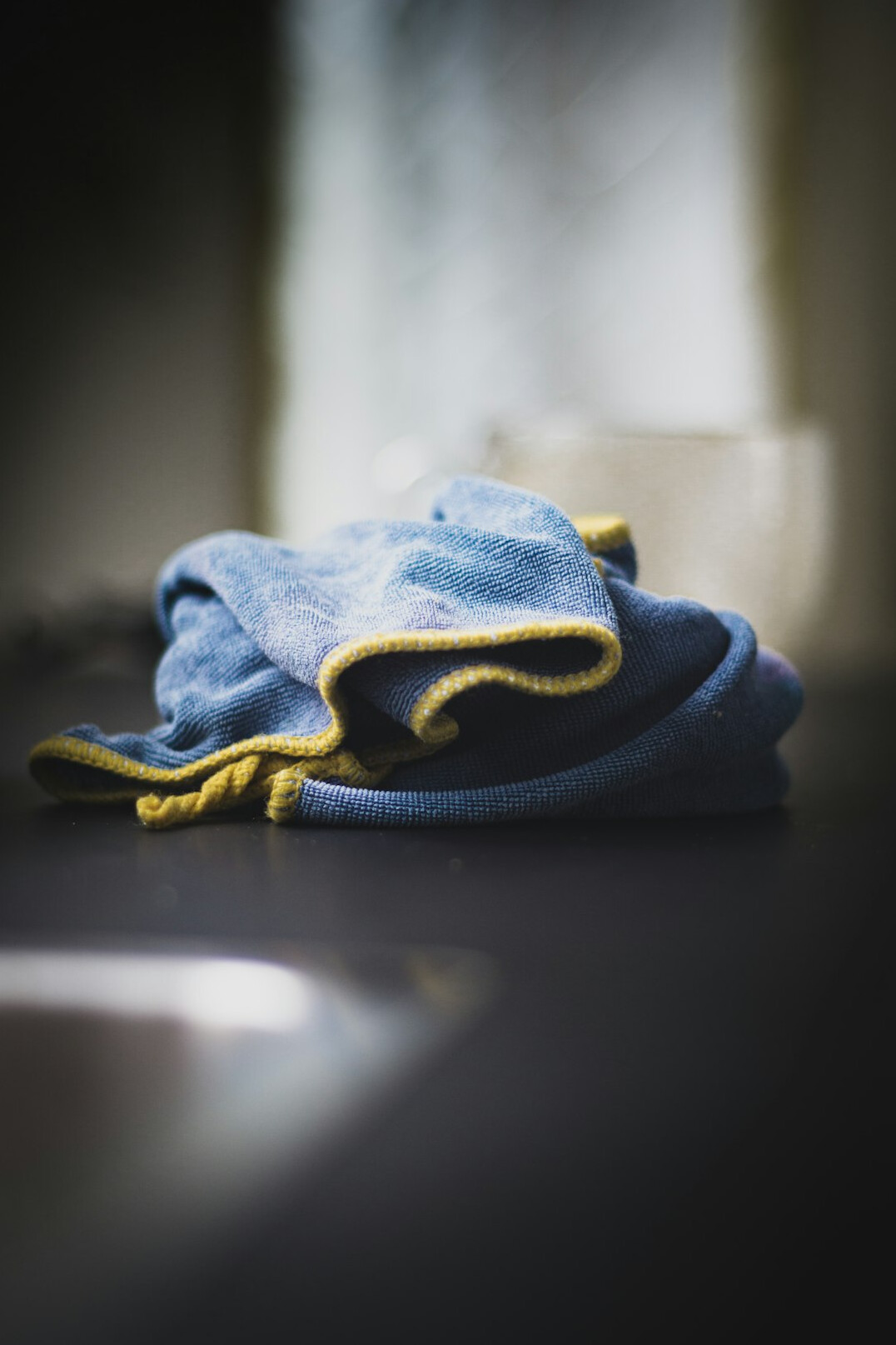Cleaning supplies and a cloth prepared for household cleaning