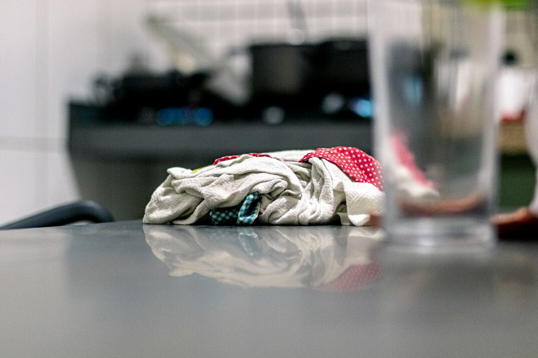 woman cleaning kitchen counter