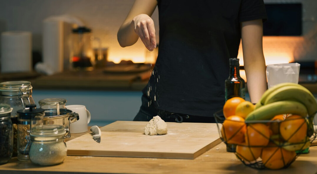 person cleaning kitchen counter